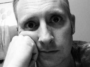 extremely tired man black and white photo